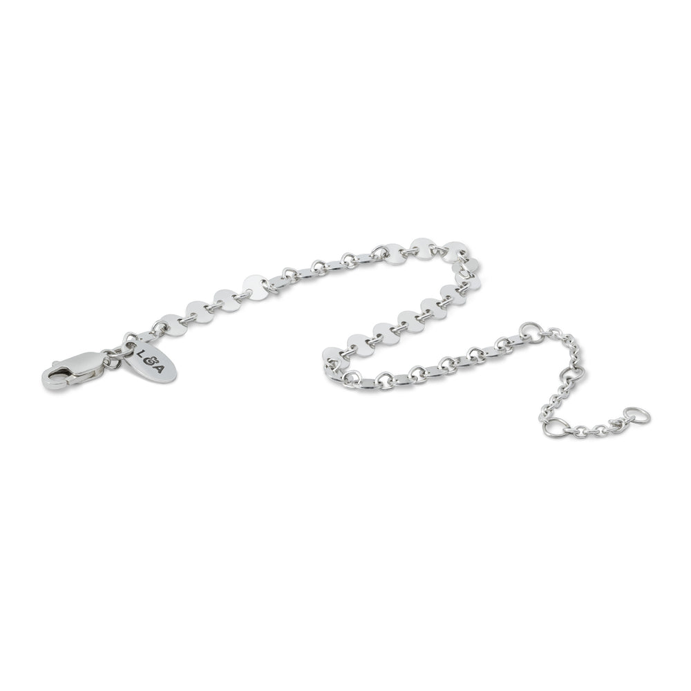 Silver mirror bracelet in wave layout on white background