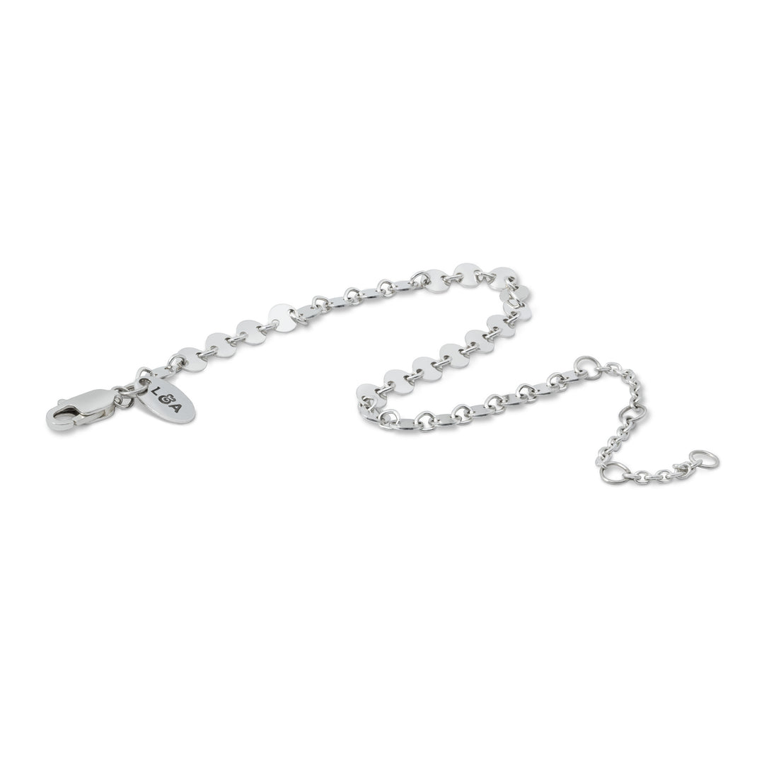 Silver mirror bracelet in wave layout on white background