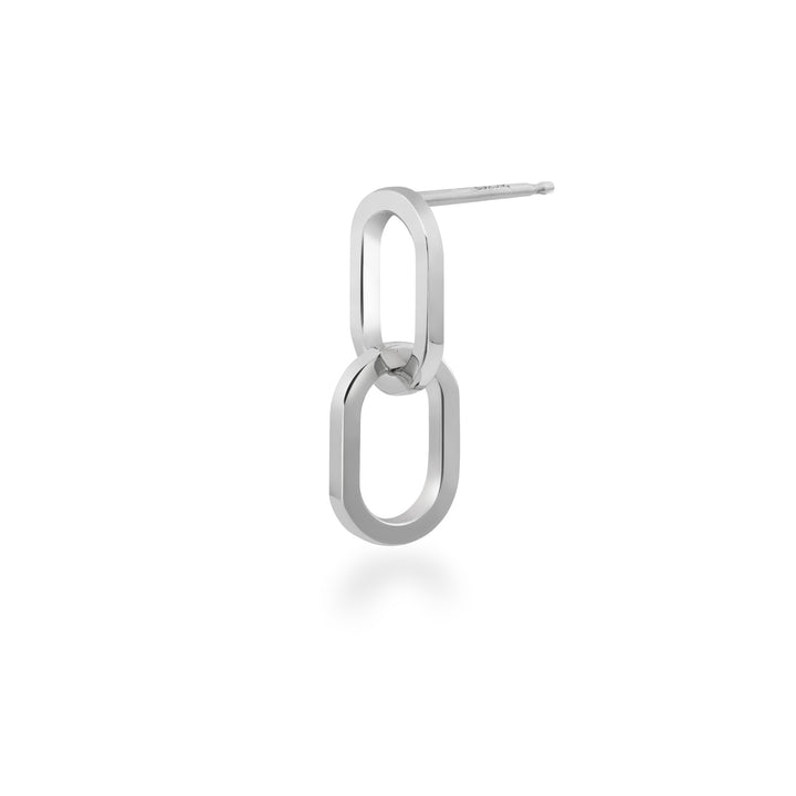Silver interlocking hoop earring on a white background at an angle
