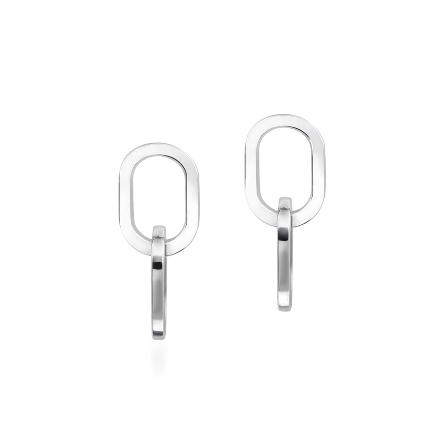 Pair of silver interlocking hoop earrings on a white background